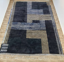 Load image into Gallery viewer, Moroccan rug adorned with unique geometric patterns