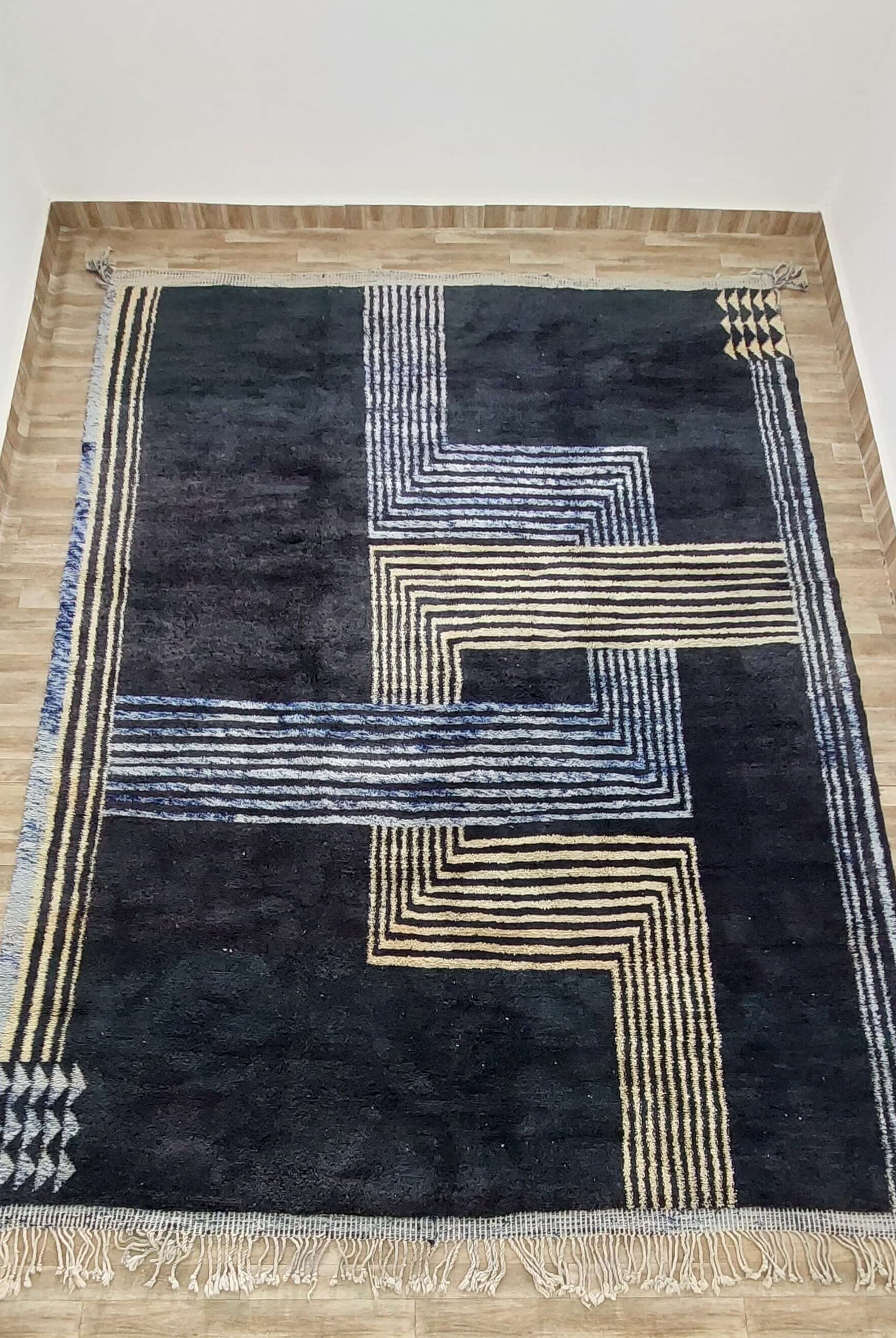 Close-up view of intricate geometric designs on a Moroccan rug