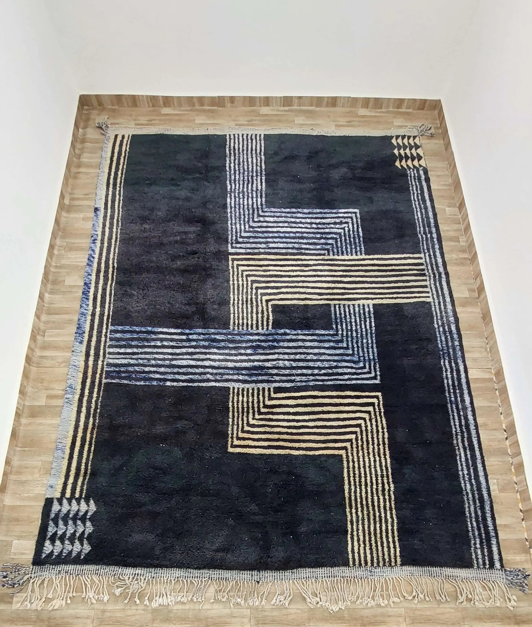 Close-up view of intricate geometric designs on a Moroccan rug