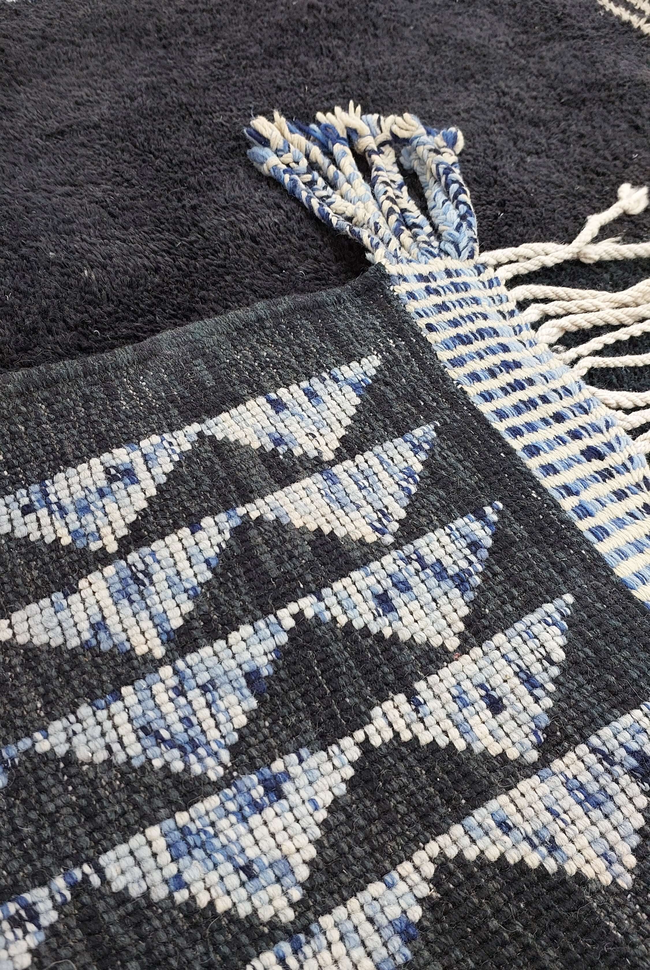 Geometrically designed blue and white Moroccan rug