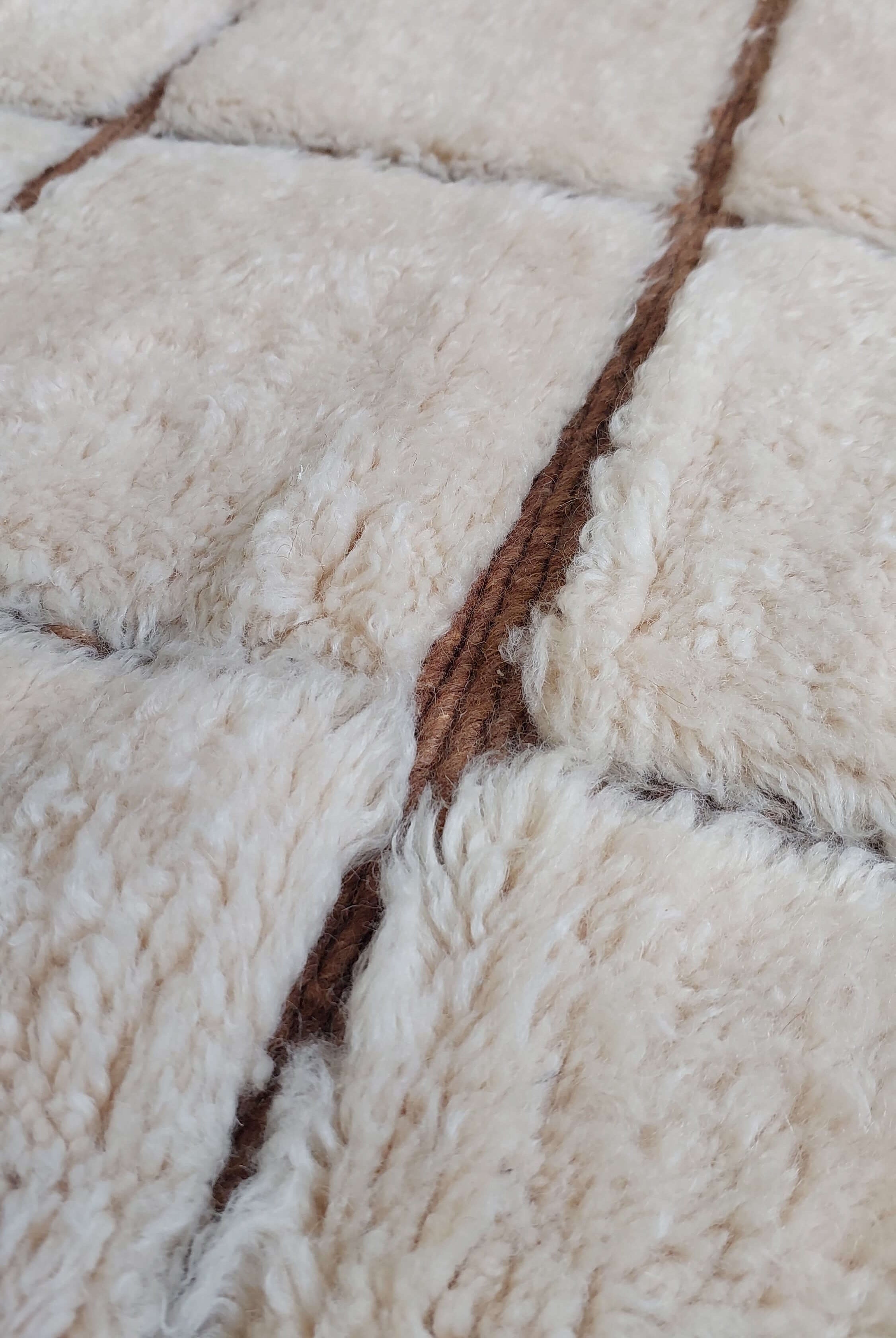 Custom Moroccan rug displaying white and brown stripes