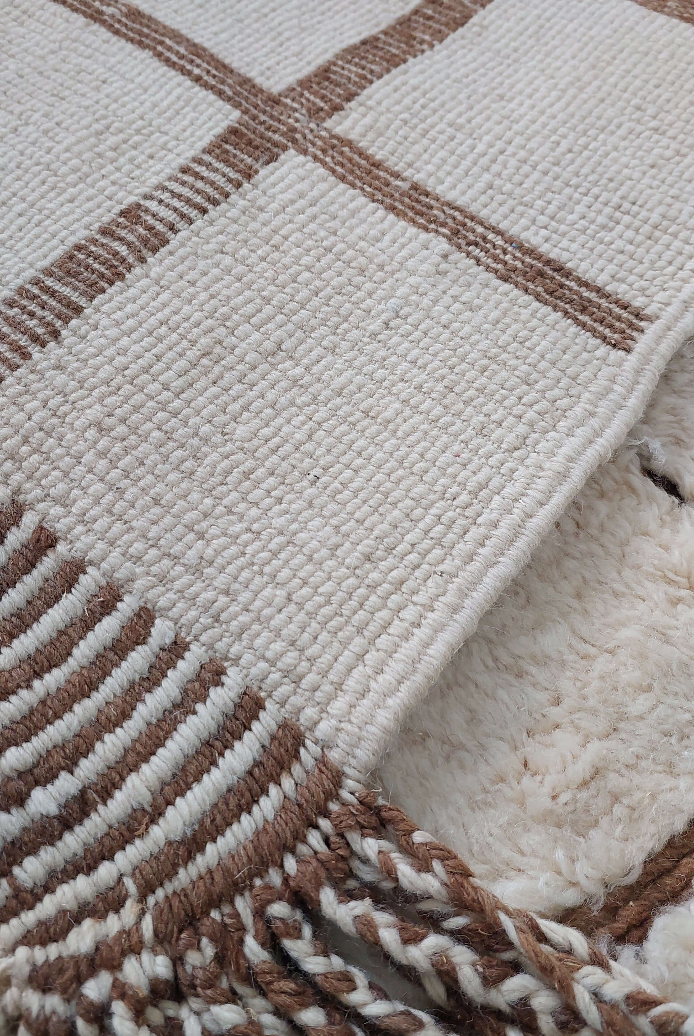 Close-up image of a custom Moroccan rug highlighting its tassel