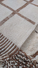 Load image into Gallery viewer, Close-up image of a custom Moroccan rug highlighting its tassel