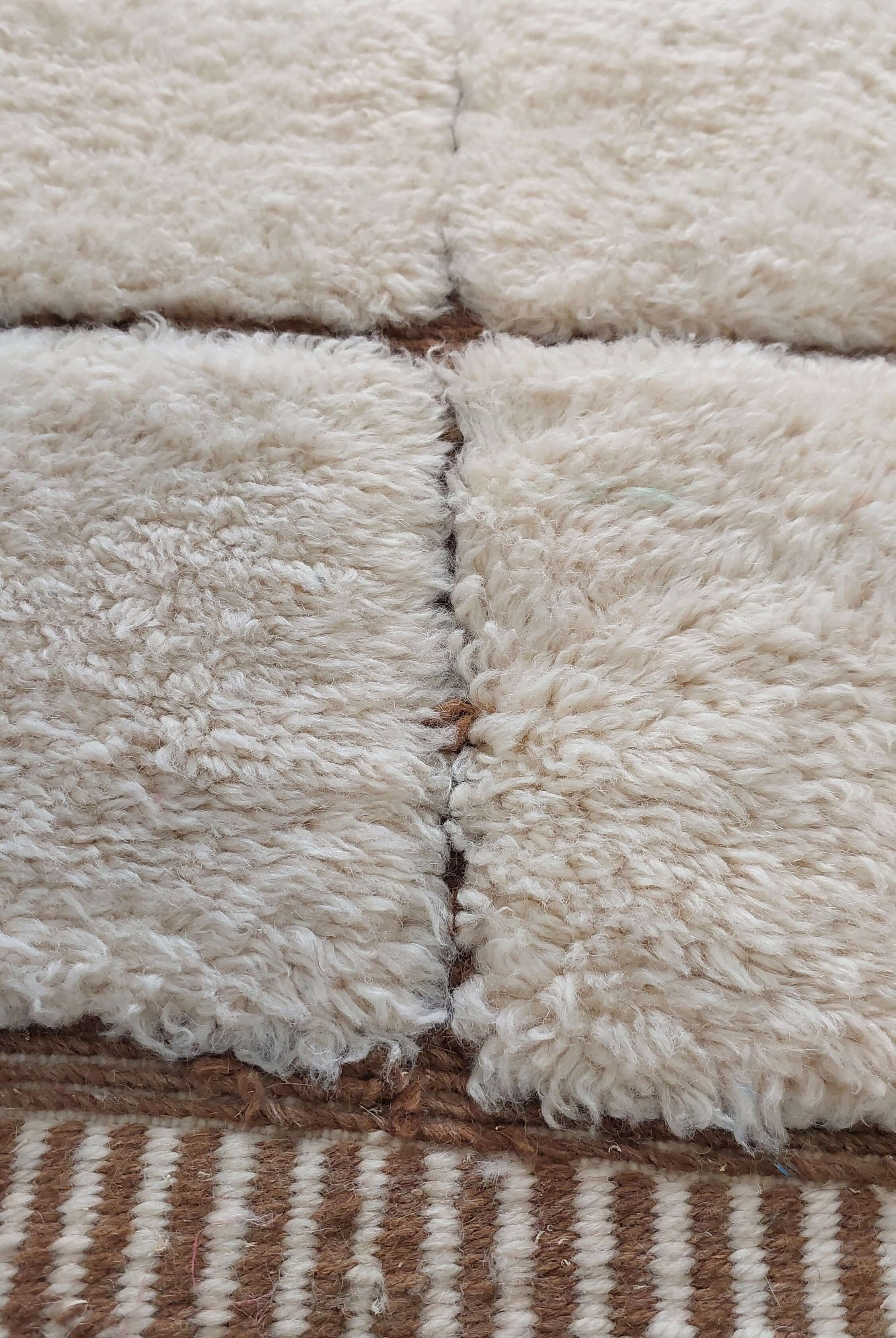 Custom Moroccan rug displaying white and brown stripes