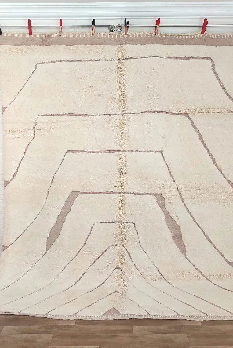Moroccan Beni mrirt rug art piece with abstract design on a wooden floor