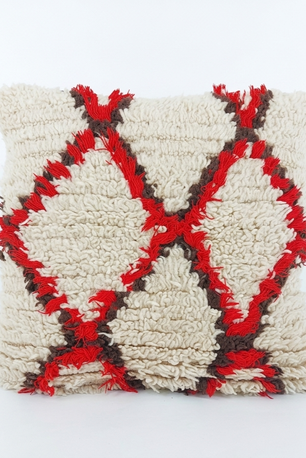 Decorative pillow with a geometric pattern on a white background