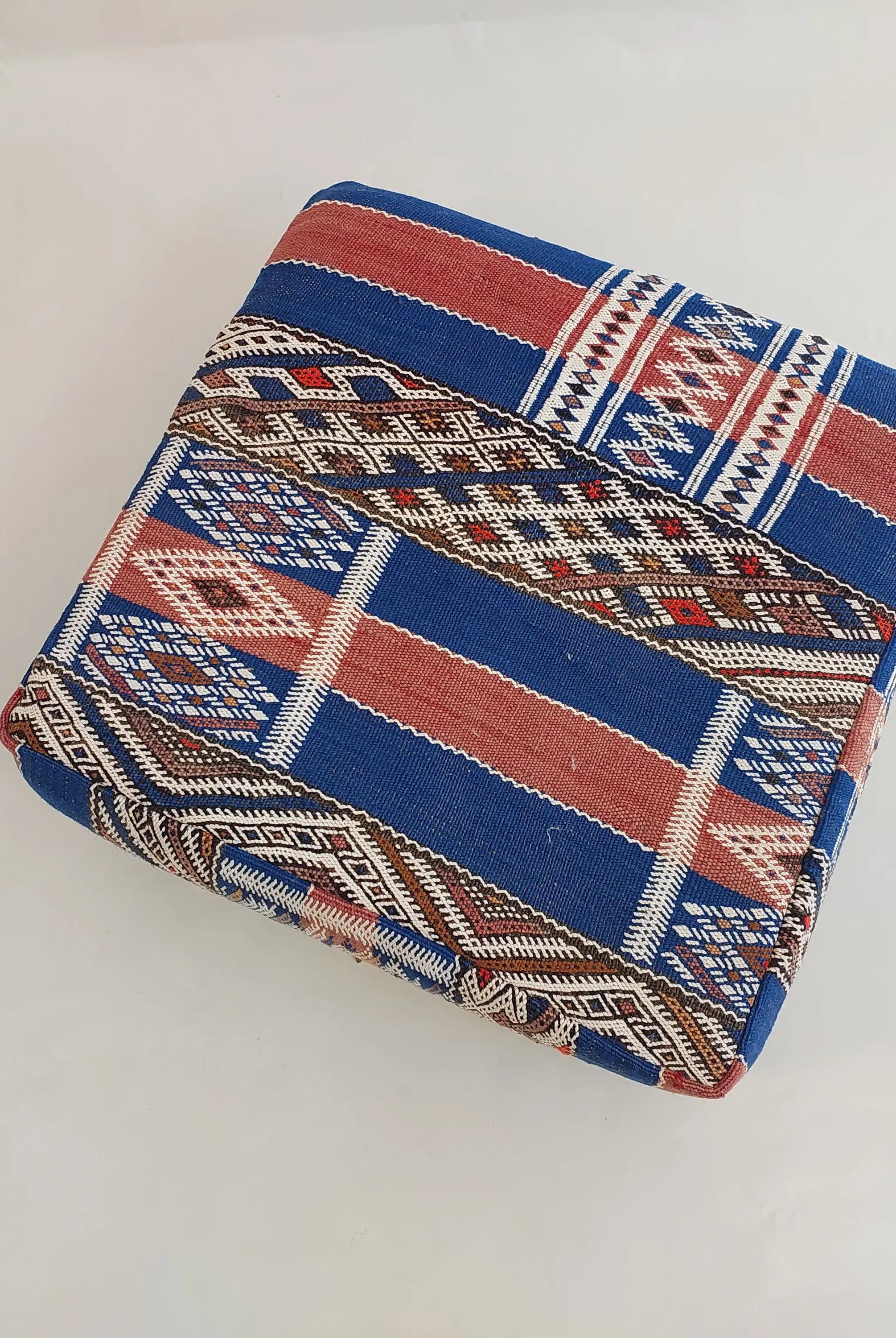 Folded fabric with a geometric pattern on a white background