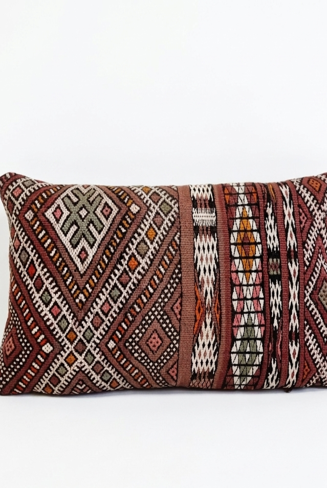 Decorative pillow with geometric pattern on a white background