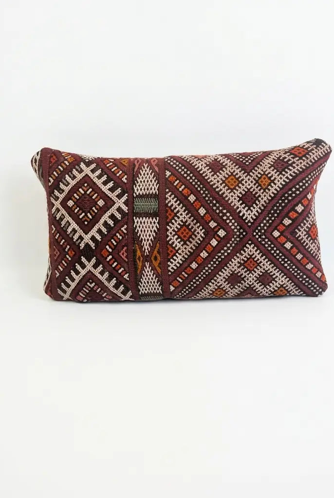 Decorative pillow with geometric pattern on a white background