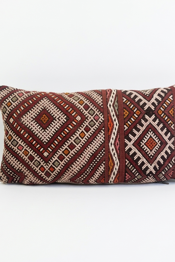 Decorative pillow with geometric pattern on a white background