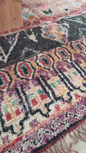 Load image into Gallery viewer, Masterpiece Moroccan Rug displayed on a wooden floor under a table