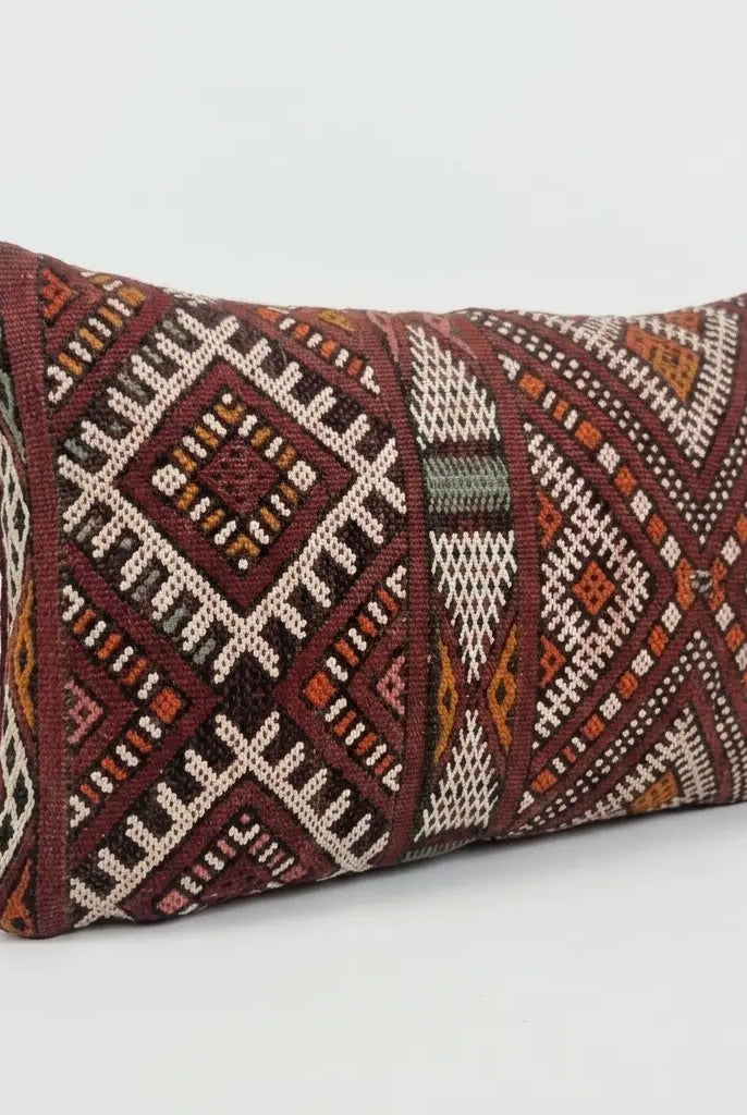 Decorative pillow with geometric pattern on a white background