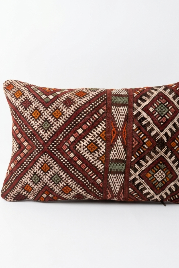Decorative pillow with geometric pattern on a white background