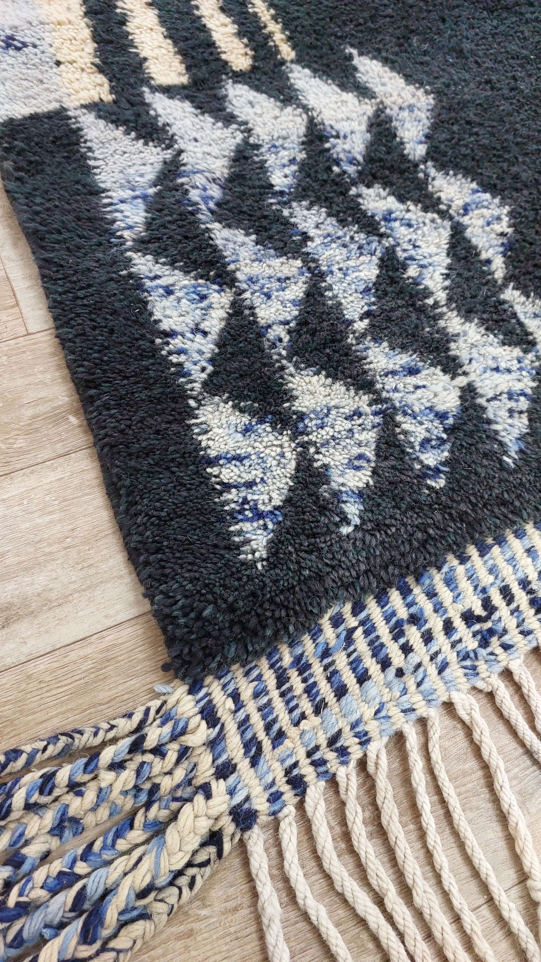 Blue and black Moroccan rug with fringe detailing
