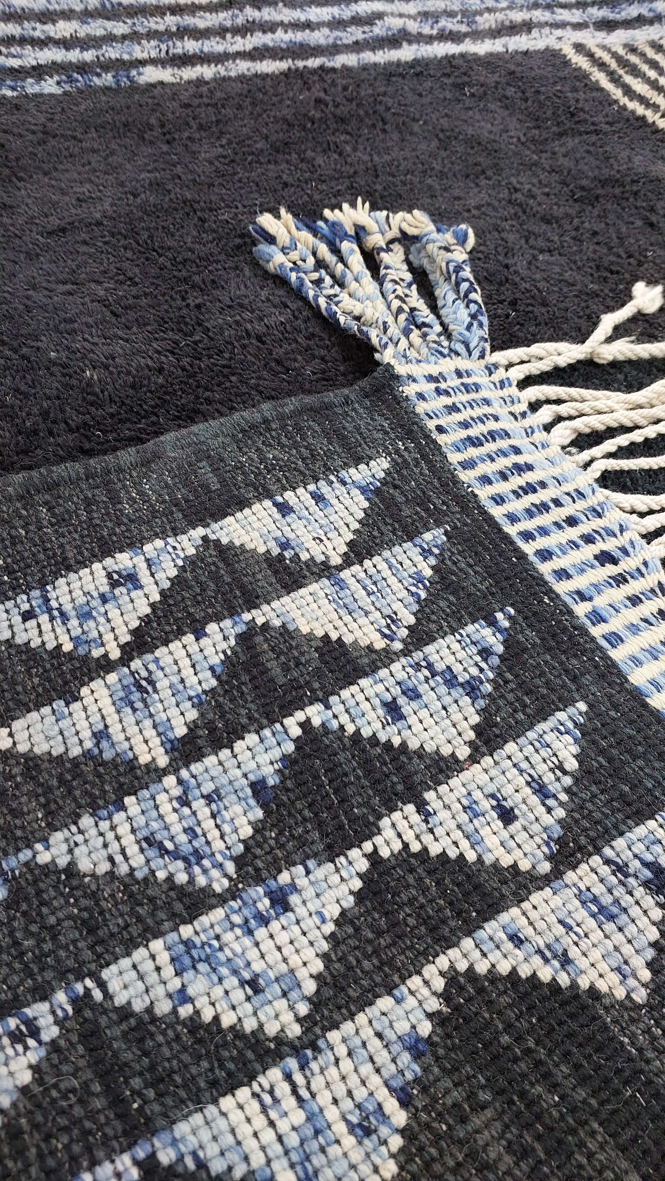 Geometrically designed blue and white Moroccan rug