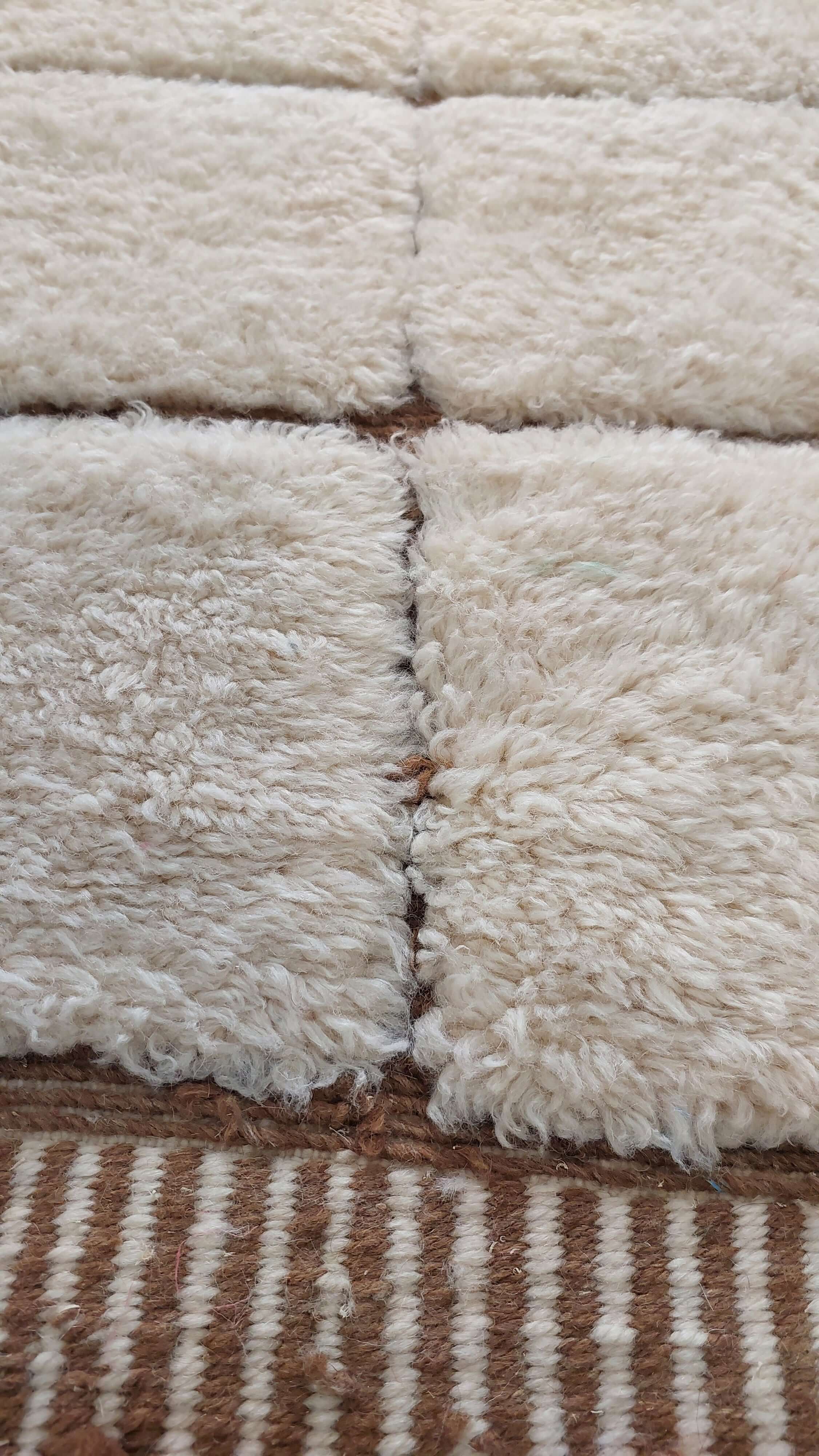 Custom Moroccan rug displaying white and brown stripes