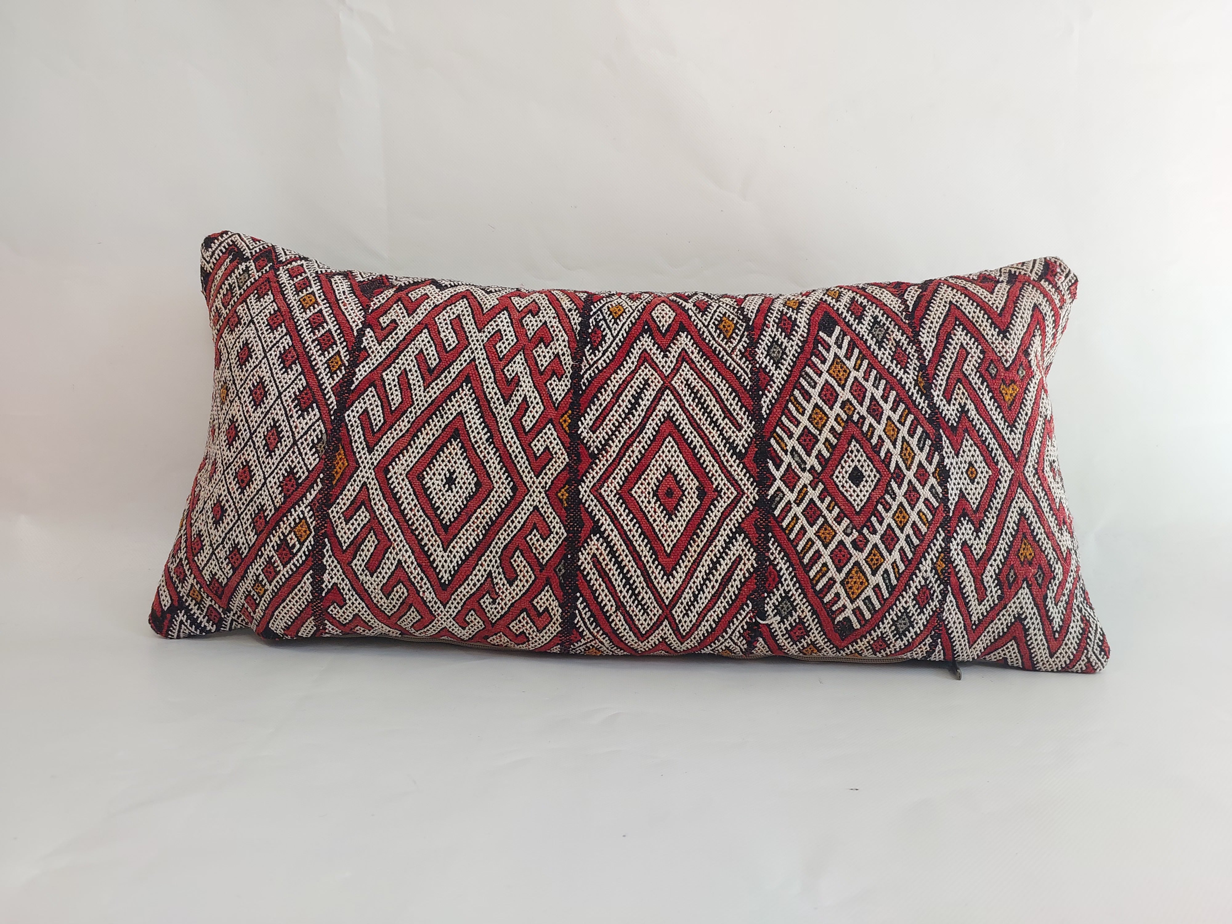 Decorative pillow with geometric pattern on a white background