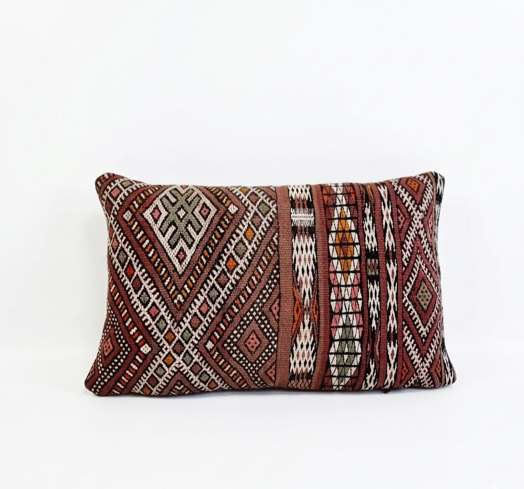 Decorative pillow with geometric pattern on a white background