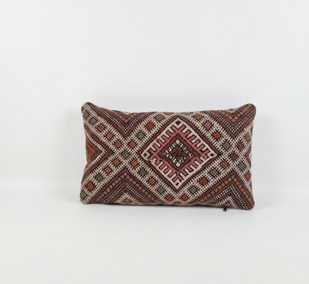 Decorative pillow with geometric pattern on a white background