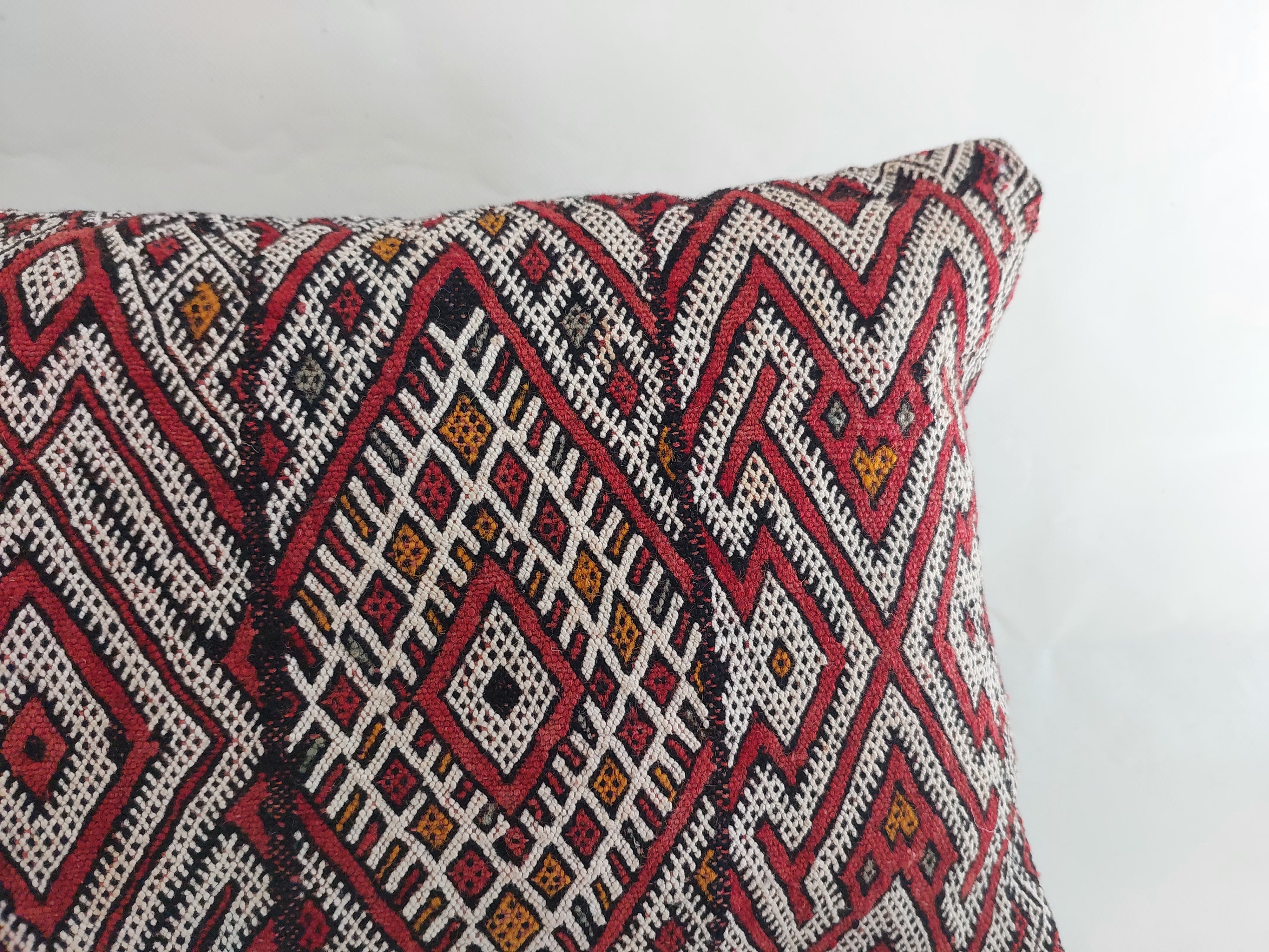 Decorative pillow with geometric pattern on a white background