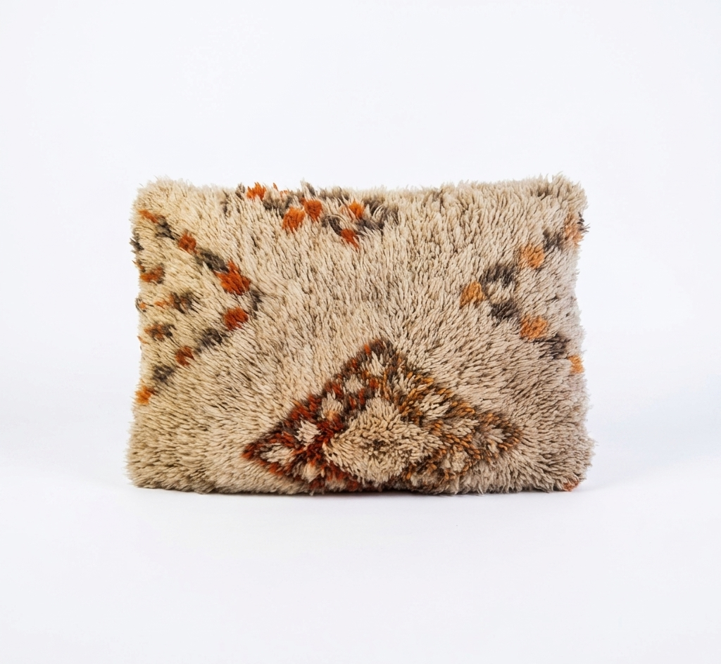 Textured pillow with geometric pattern on a white background