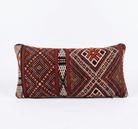 Decorative pillow with geometric pattern on a white background
